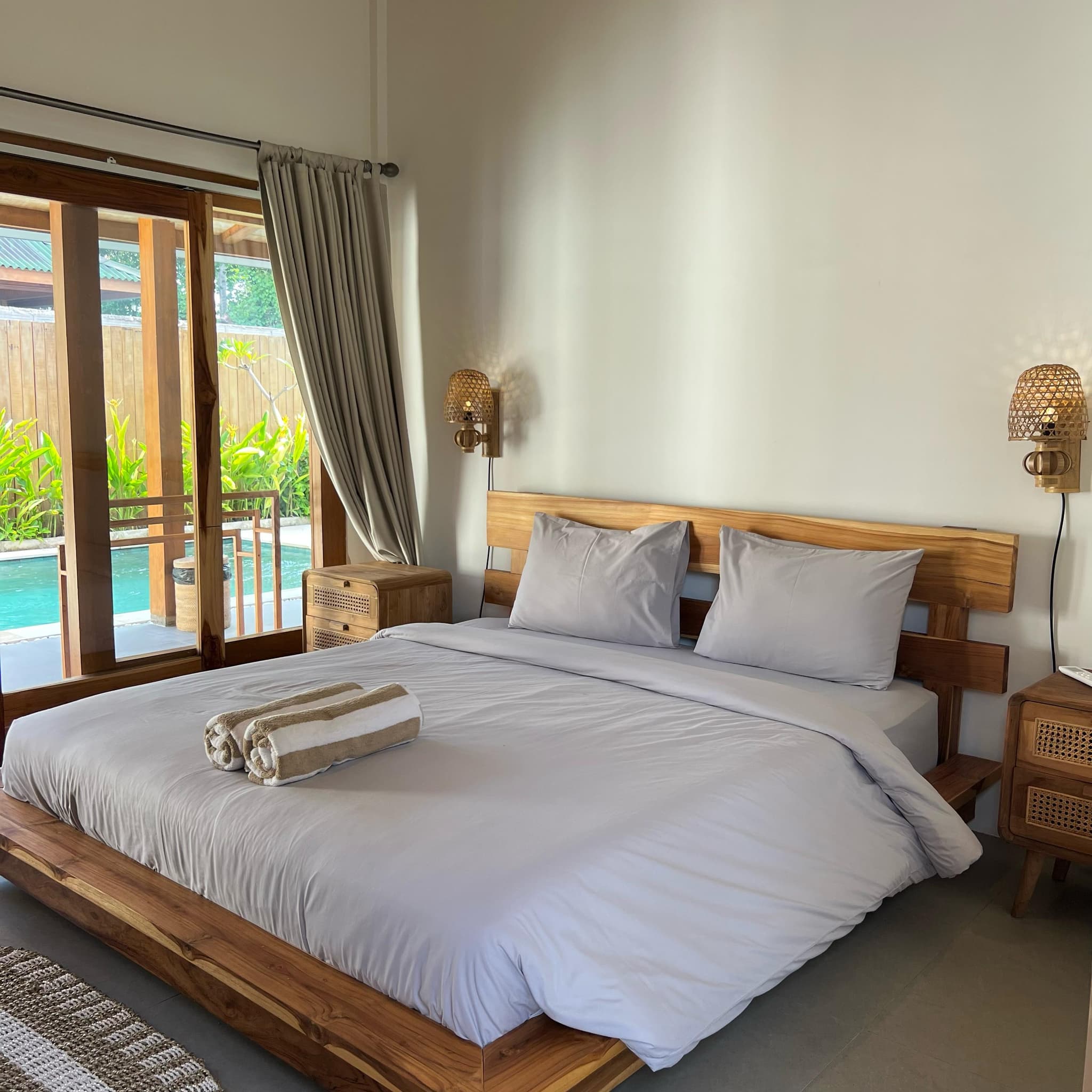Bedroom opening onto the villa pool
